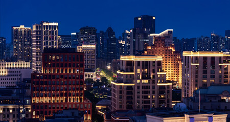 Obraz premium Shanghai Cityscape at Twilight with Illuminated Skyscrapers