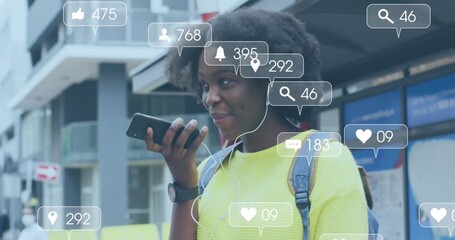 Animation of social media icons over african american woman using smartphone - Powered by Adobe