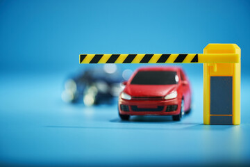 toy car at the exit of carpark entrance with parking barrier