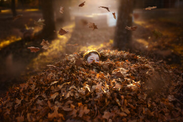 Child Hiding in Leaf Pile with Falling Leaves