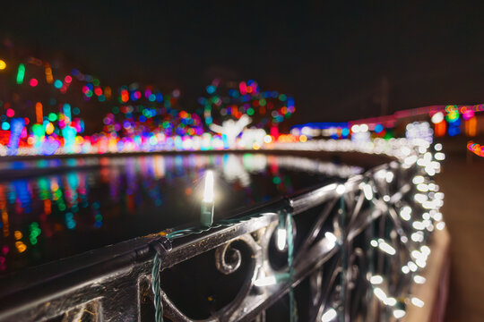 Railing of Christmas Lights Leading to Bokeh
