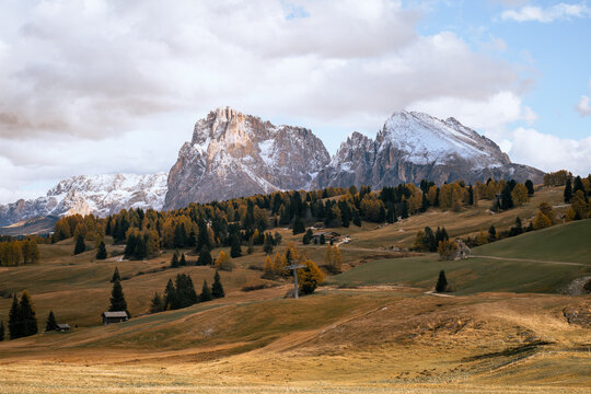 Autumn Dolomites landscape with alpine meadows and snow peaks