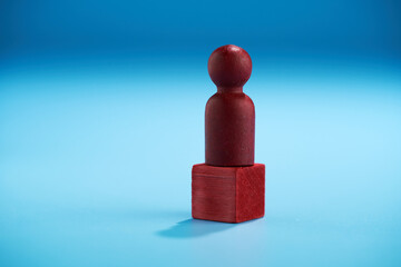 Symbolic leadership concept with leader on podium.