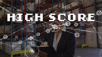 Animation of network of connections with icons and high score over caucasian warehouse worker - Powered by Adobe