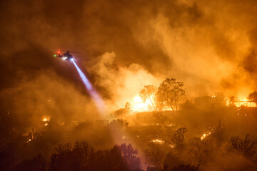 Helicopter Flys by as Will Rodgers Park Burns in Wildfire