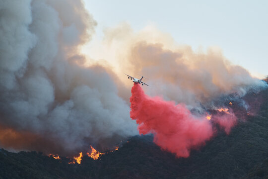 Plane Drops Fire Retardant as Will Rodgers Burns
