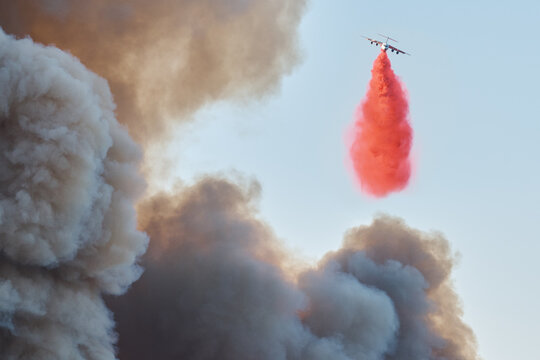 Plane Drops Fire Retardant as Will Rodgers Burns