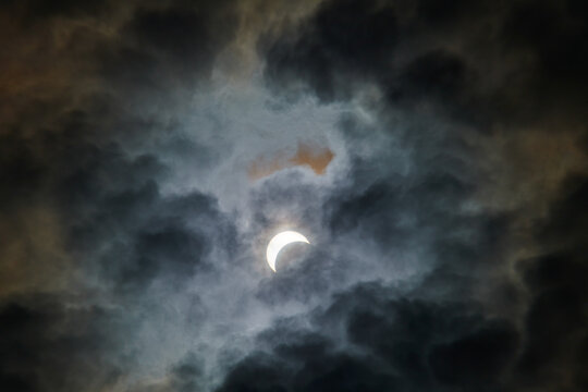 Total Solar Eclipse Against a Cloudy Sky