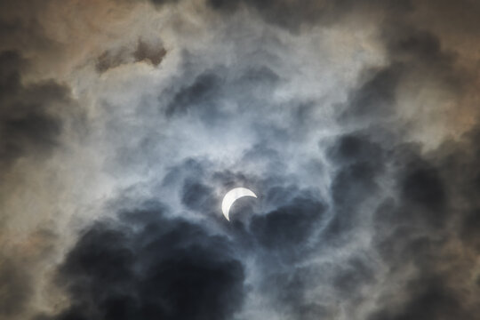 Total Solar Eclipse Against a Cloudy Sky