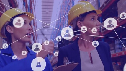 Animation of network of connections over diverse women working in warehouse - Powered by Adobe