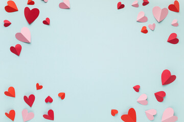 Obraz na płótnie Canvas Love hearts on blue blank background. Valentine or Mother Day greeting card festive mockup.