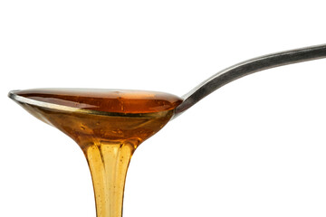 honey dripping from spoon