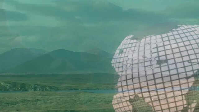 Semi-transparent wireframe globe floating over river plain, hills rising under cloudy mountains