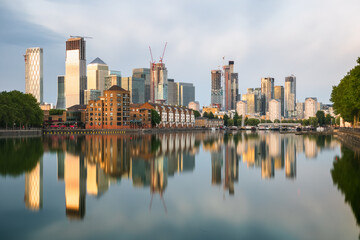 London cityscape Canary Wharf with reflection mirrored from Greenland Dock