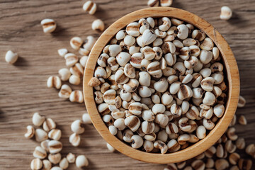 Close-Up View of Fresh Organic Grains in Wooden Bowl on Tabletop