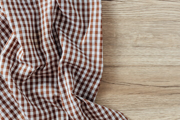 Brown and White Gingham Fabric on Rustic Wooden Surface