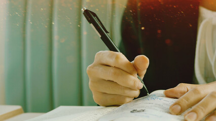 Writing activities involving note-taking using pen and paper, learning and storytelling, freelance writing, and office paperwork.