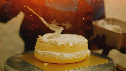 Baking birthday cakes at a restaurant by hand is a typical task for a professional chef.