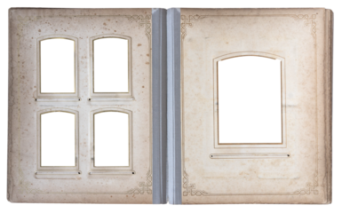 Open vintage photo album with multiple decorative frames and empty picture windows on aged paper pages