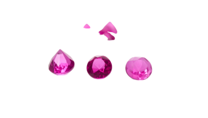 Group of various pink gemstones on a black background, close-up
