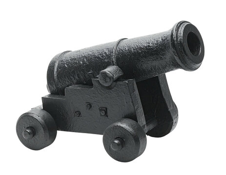 Isolated antique cannon with dark finish on wheels and a carriage, shot against a black backdrop