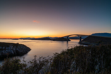 view of the Storseisundet Bridge on the Atlantic Ocean Road at sunrise © makasana photo