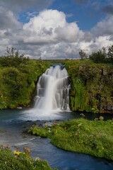 Fototapeta premium view of the left cascade of the Arbaejarfoss waterfall in southern Iceland near Hvolsvollur