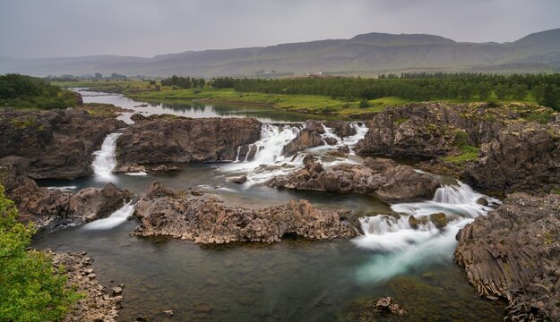 view of the idyllic Glanni Waterfall in the Nordurardalur Valley in West Iceland