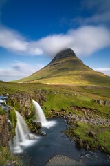 view of the picturesque Kirkjufellsfoss Waterfall o nthe Snaefellsnes Peninsula in western Iceland