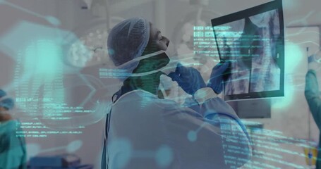 Medical data processing animation over doctor examining X-ray in hospital - Powered by Adobe
