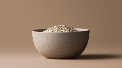 Simple Taupe Bowl with Oats on Warm Background