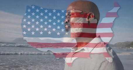 USA flag overlaying thoughtful man silhouette by ocean with animation effect - Powered by Adobe