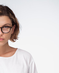 Fototapeta premium Half Face Of Young Woman With Glasses On Gradient Background With Copy Space