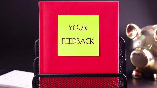 The conceptual phrase YOUR FEEDBACK MATTERS appears on a yellow sticker on a red business book