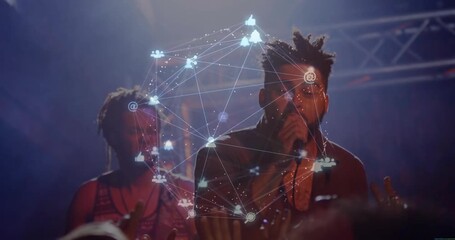 Performing duo stepping on concert stage, gripping microphone and animating network graphic overlay - Powered by Adobe