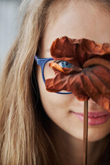Young woman posing with anthurium flower
