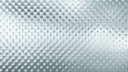 Close-up of decorative glass pattern reflecting lights