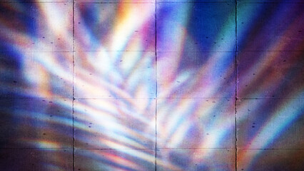 Light refracting through palm fronds creates a colorful, iridescent pattern on a tiled wall, perfect for backgrounds