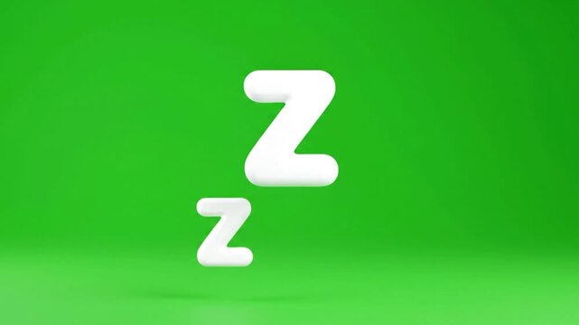 White Zzz sleep symbols floating and appearing on a green screen background