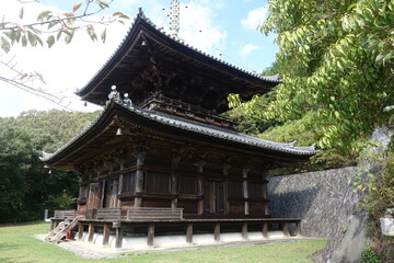 Fototapeta premium Traditional wooden Buddhist pagoda viewed from side on Shikoku Henro pilgrimage Japan
