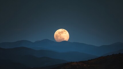 A majestic full moon ascends above silhouetted mountain ranges under a twilight sky