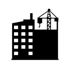 Black and white building with construction crane on top simple image