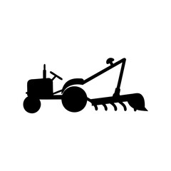 Silhouette of vintage farm tractor with plow attachment for agricultural work