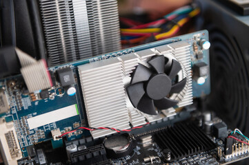 Close up of computer graphics card with cooling fan components