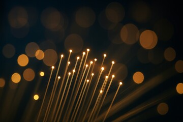 Glowing fiber optic light strands with bokeh effect on dark background showing abstract technology network concept with golden illumination.. Ai generative