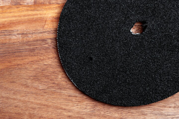 Technical water purification filter on a wooden surface. Round clean industrial part