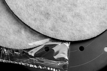 Technical water purification filters on a black metal surface. New clean industrial parts