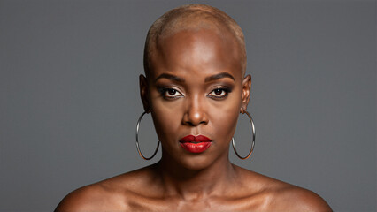Stylish Bald Woman with Red Lipstick and Hoop Earrings