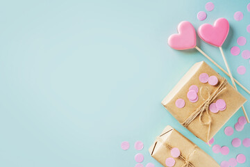 Valentines day concept with craft gift box and pink heart shape lollypop