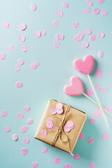 Valentines day concept with craft gift box and pink heart shape lollypop
